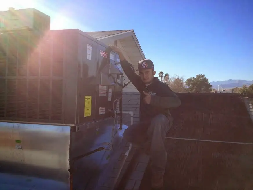 HVAC technician performing Boiler Repair on a rooftop unit in Rancho Murieta